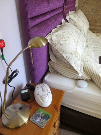 The Ei 170 RF Fire alarm from Aico has a radio link to the fire alarm circuit.